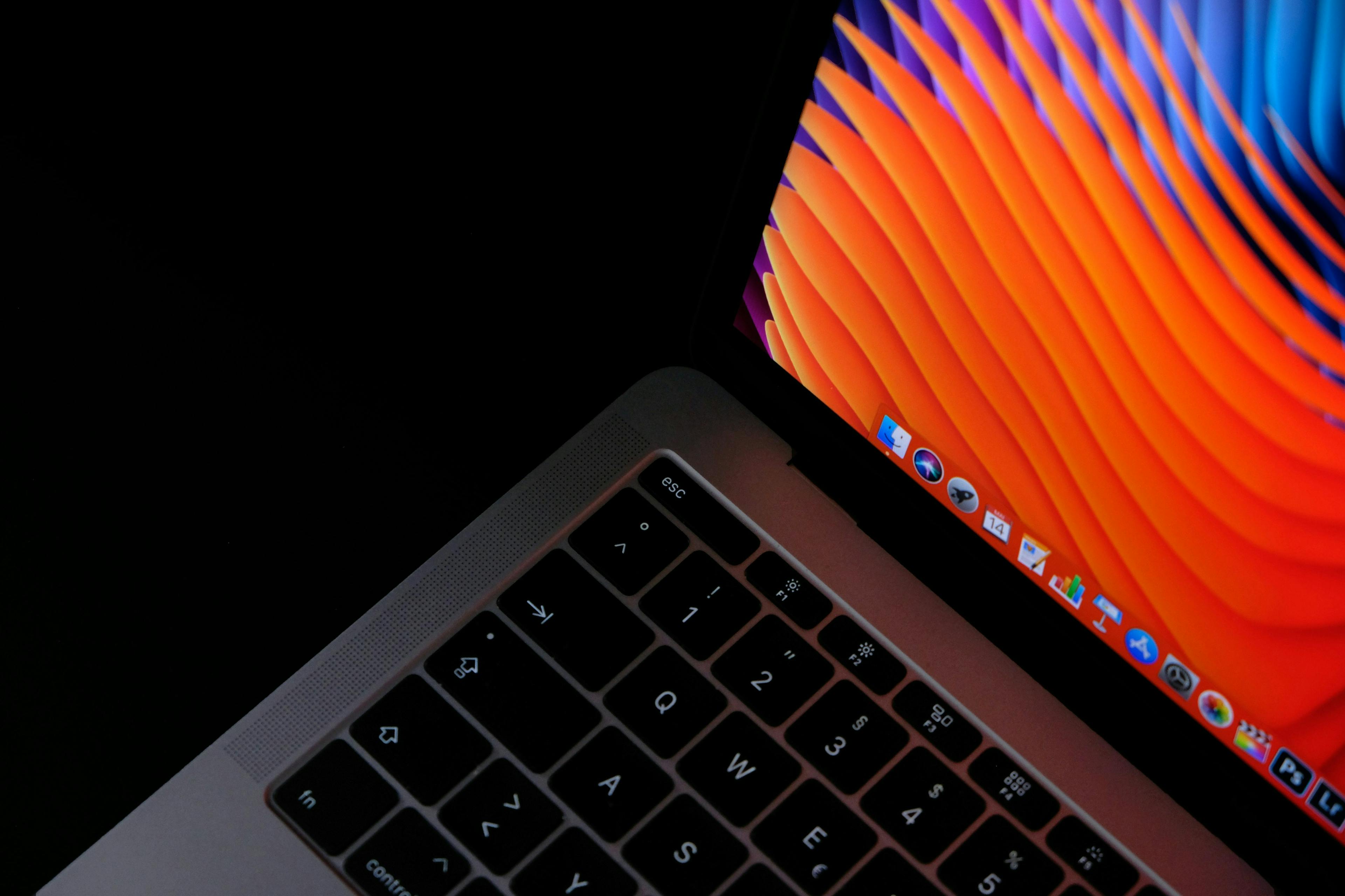 MacBook open on desktop.