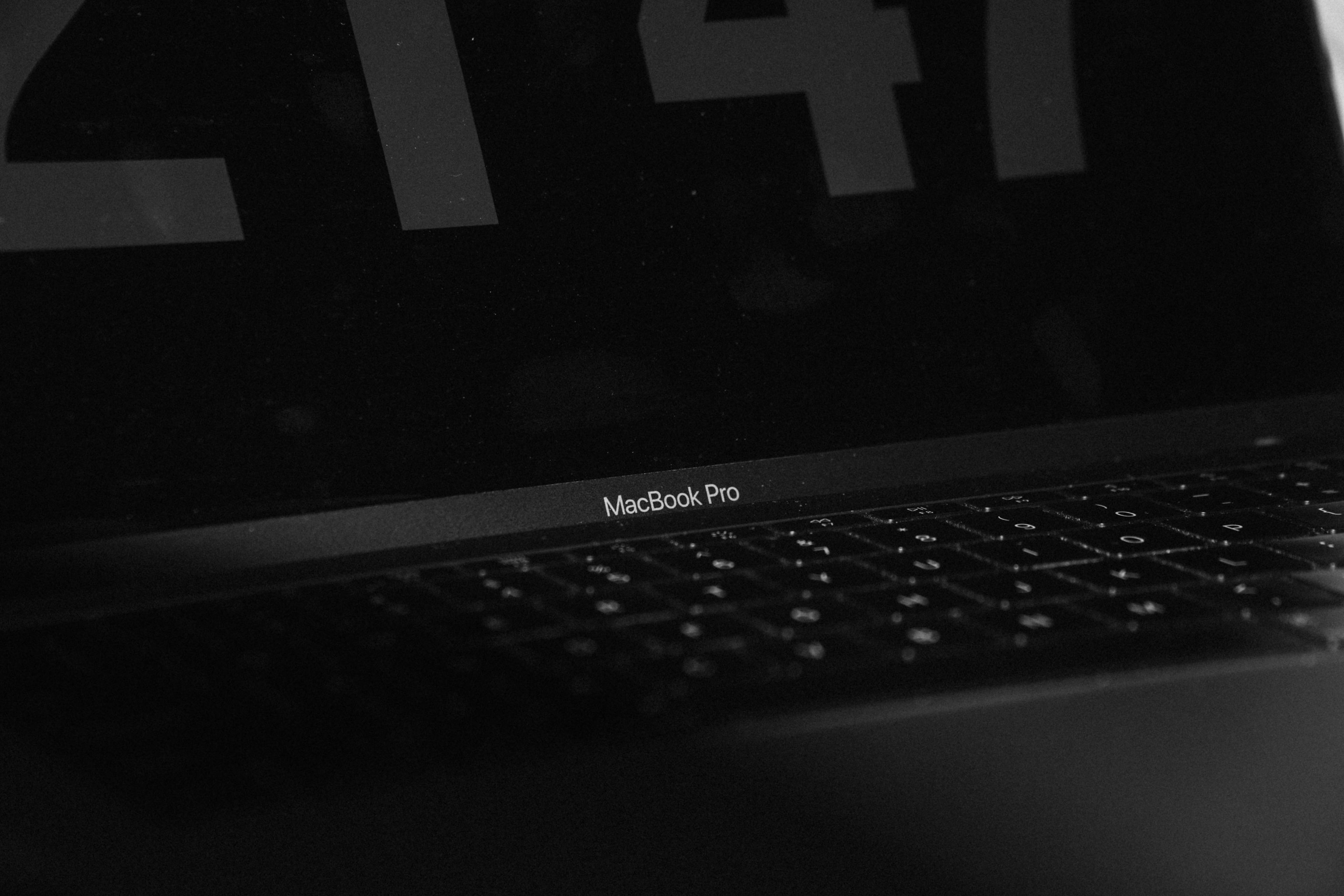 MacBook powered off, open.
